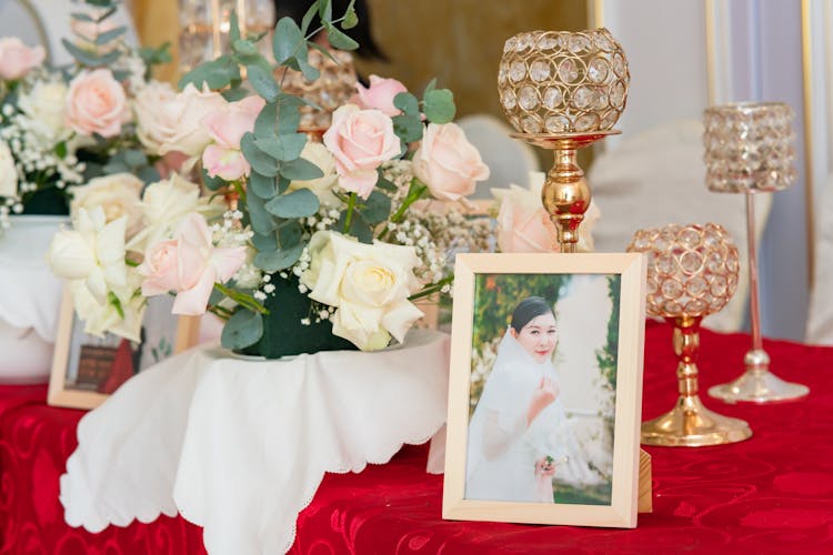 Woman Picture, Chalices And Flowers On Table