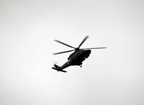 Monochrome Photo of Flying Helicopter