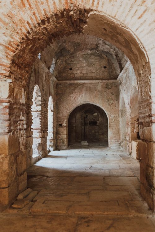 Free Explore the ancient stone corridors and arches in Antalya's historic architecture. Stock Photo