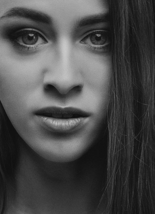 Free Artistic black and white close-up portrait showcasing a woman's expressive face. Stock Photo