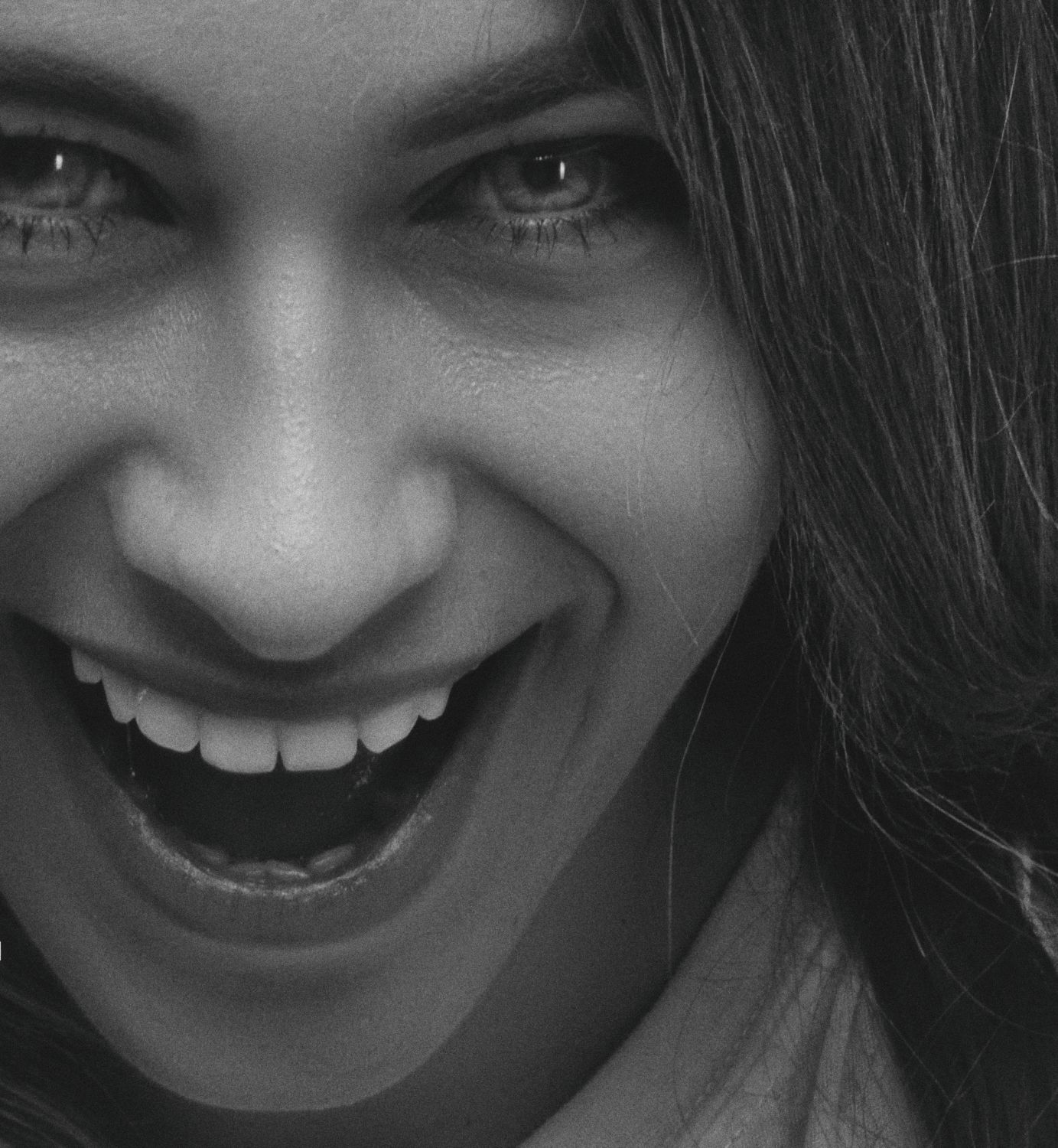 Black and White Close-up Portrait of a Young Woman Smiling · Free Stock ...