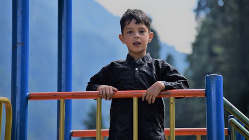 A Boy Standing on the Playground