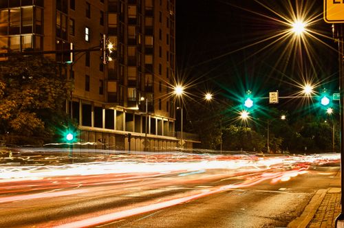Free Long exposure shot of a city street at night, capturing vibrant light trails and urban ambiance. Stock Photo
