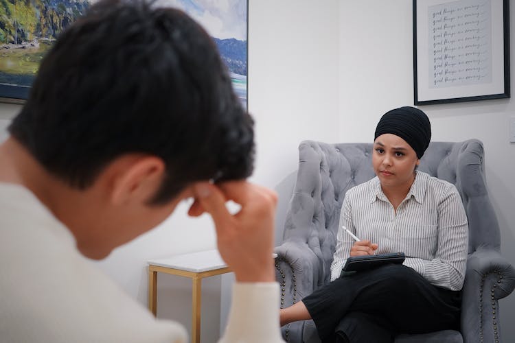 Doctor Woman Sitting With Patient