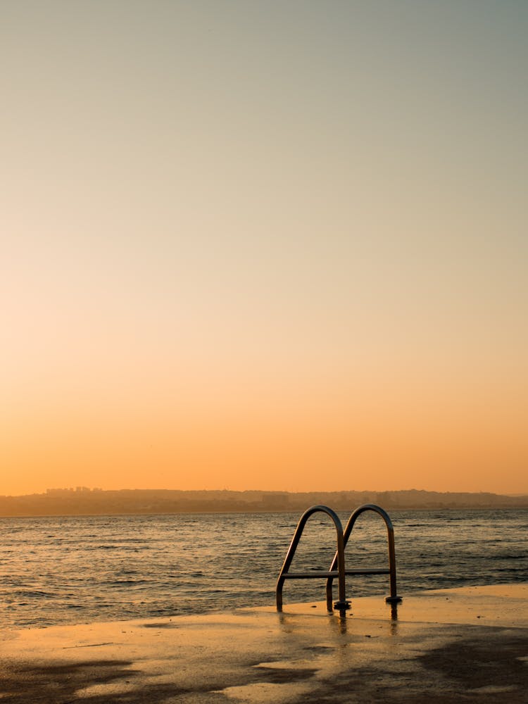 Ladder To Sea On Shore