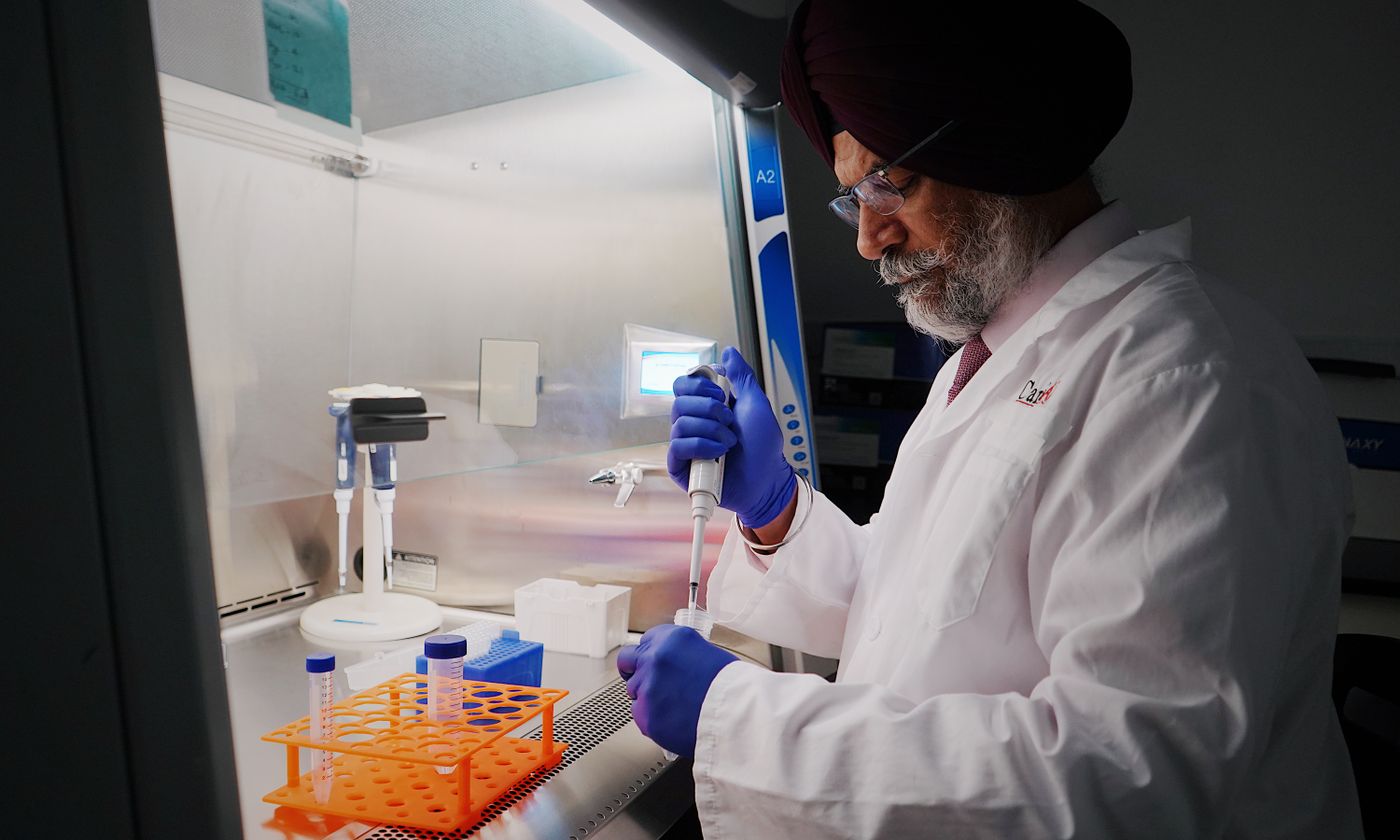 Scientist performing laboratory work with a pipette