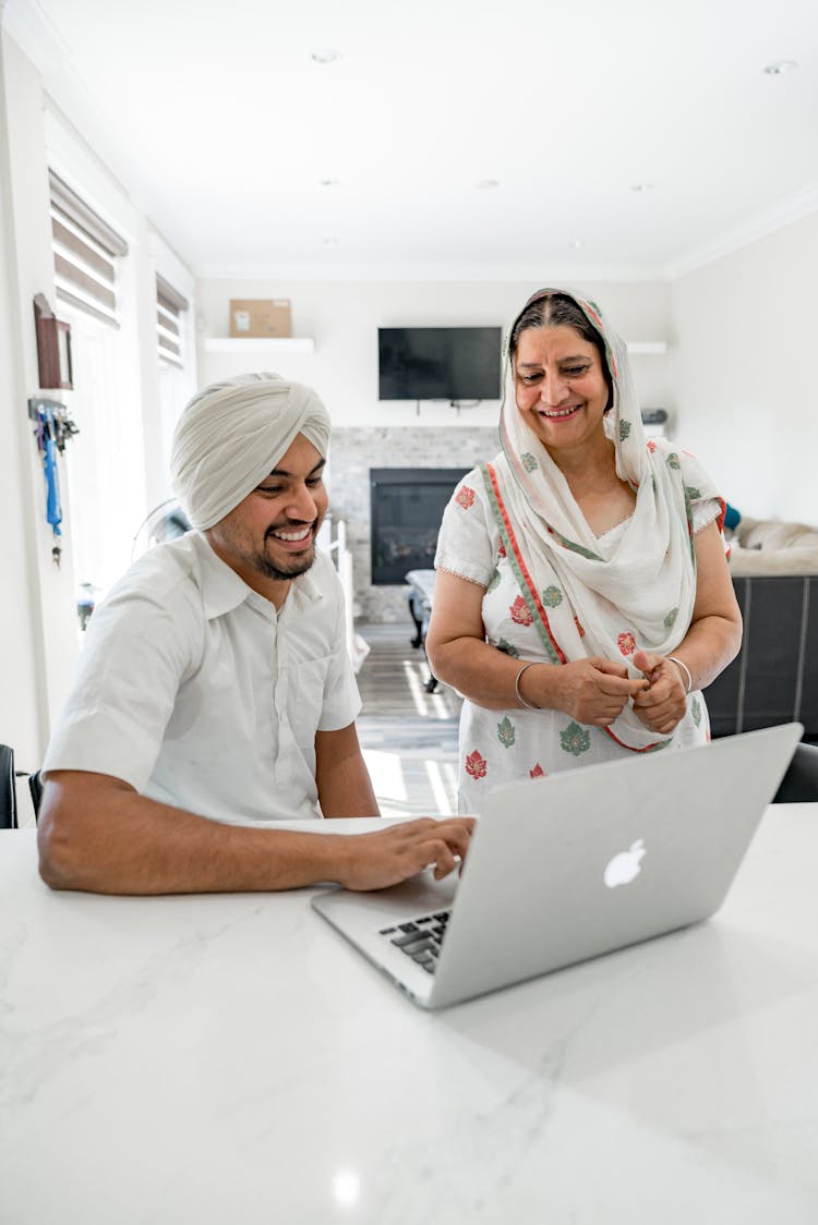 Man And Woman Using Laptop