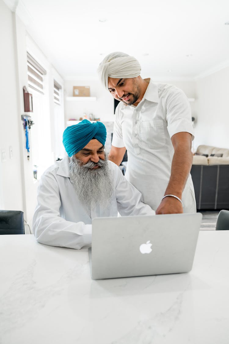 Sikh Men Using Laptop