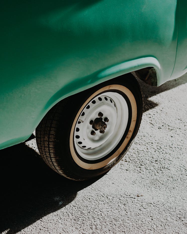 Close Up Of Vintage Car Wheel And Livery