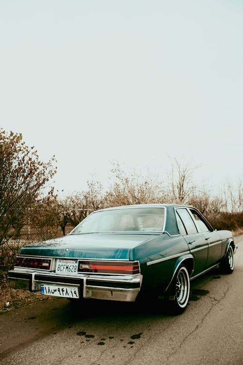 View of a Vintage Buick Parked on the Side of a Street 