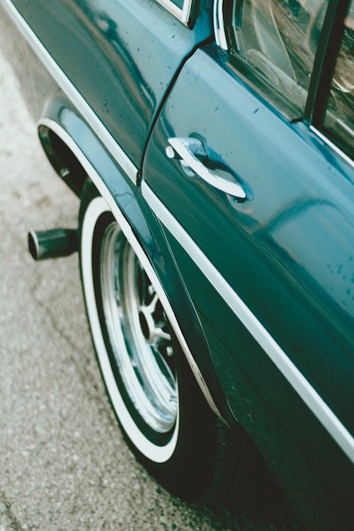 Close-up of the Side of a Vintage Green Car 