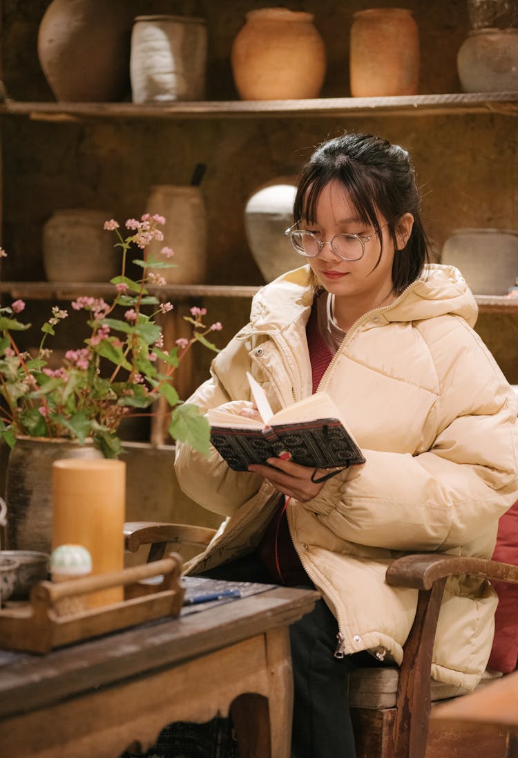 Young Woman In Quaint Cafe