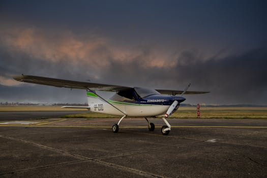 A light aircraft on the tarmac at sunset, Bydgoszcz Airport, Poland.