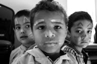 Boys with Face Paint in Grayscale Photography