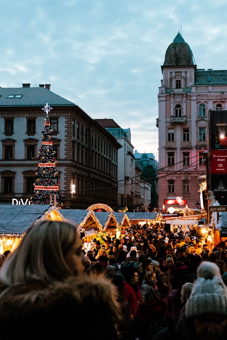 A Group Of People Near Buildings
