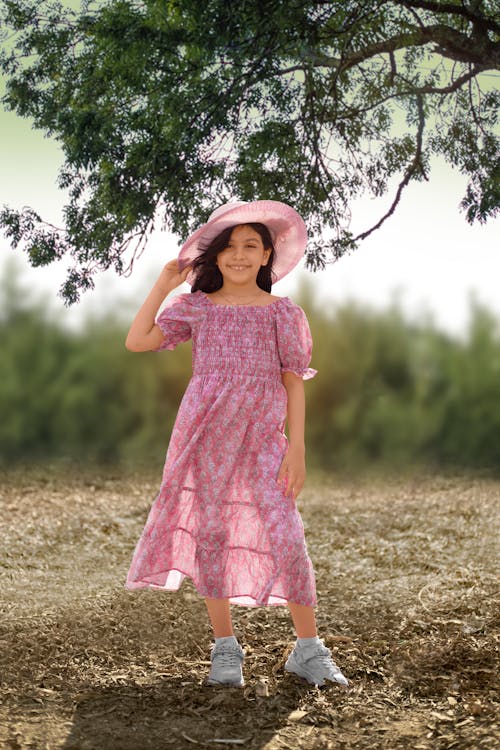 Photograph of a Girl in a Pink Dress