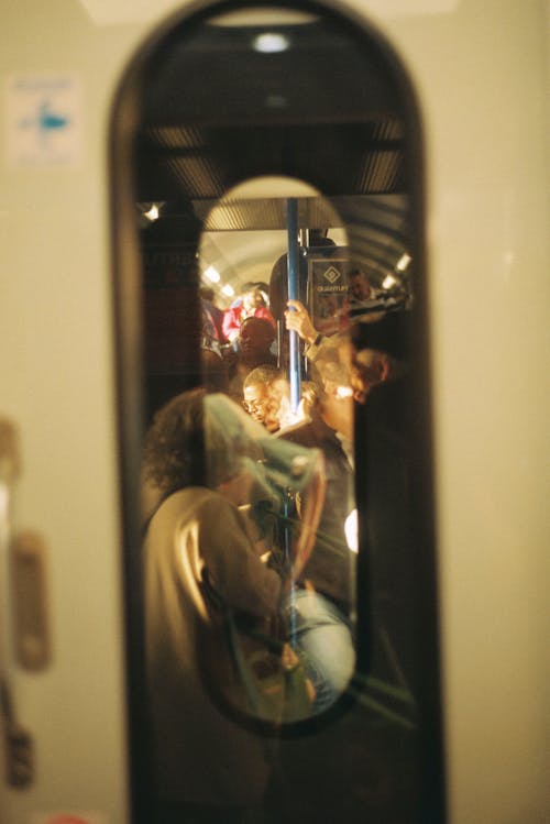 Crowded Metro Train behind Window