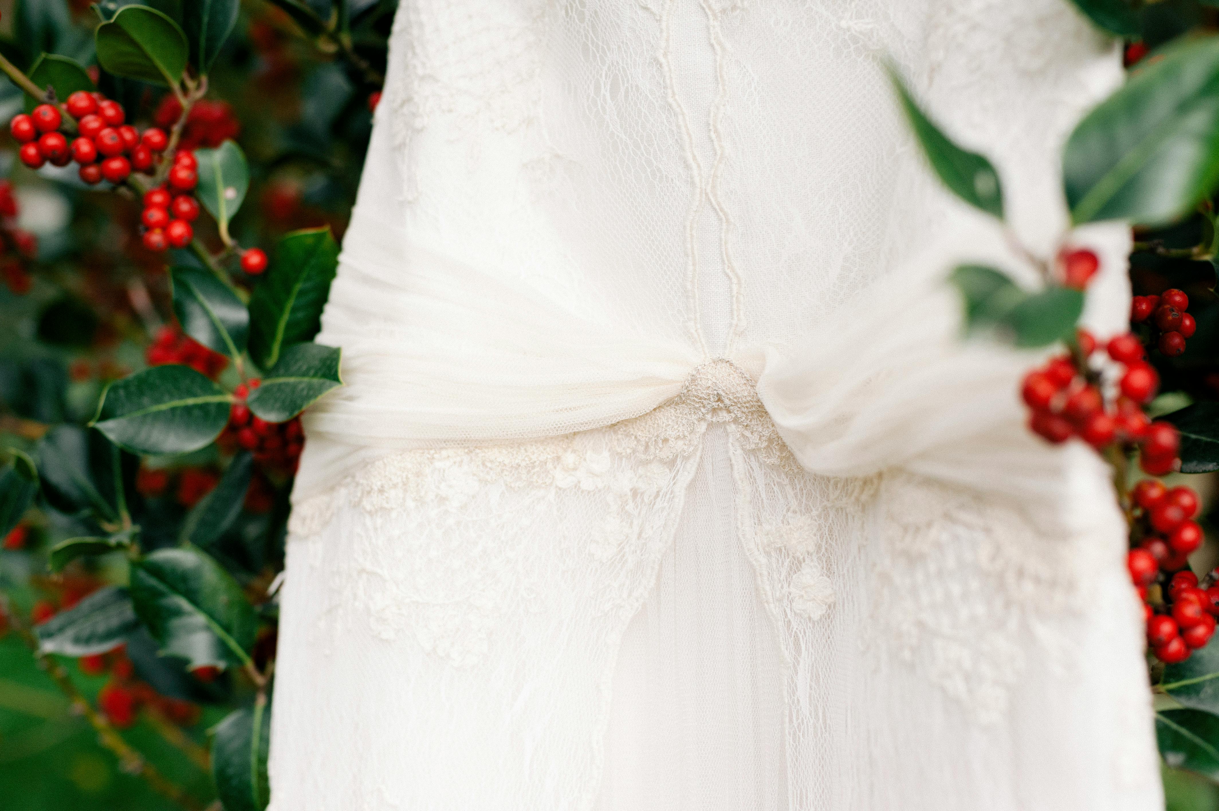 Bride and groom posing in botanic garden with floral background