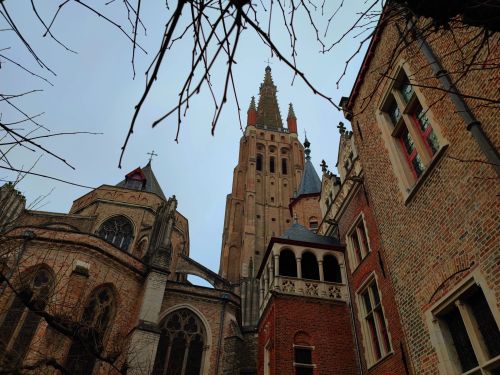 Free Low-angle view of the Gothic Church of Our Lady in Bruges, showcasing historical Belgian architecture. Stock Photo
