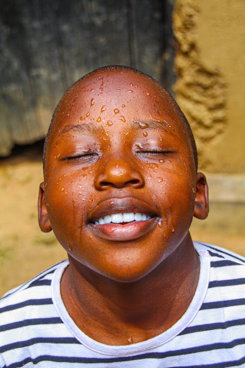 Fotos de stock gratuitas de agua, cara, chico africano