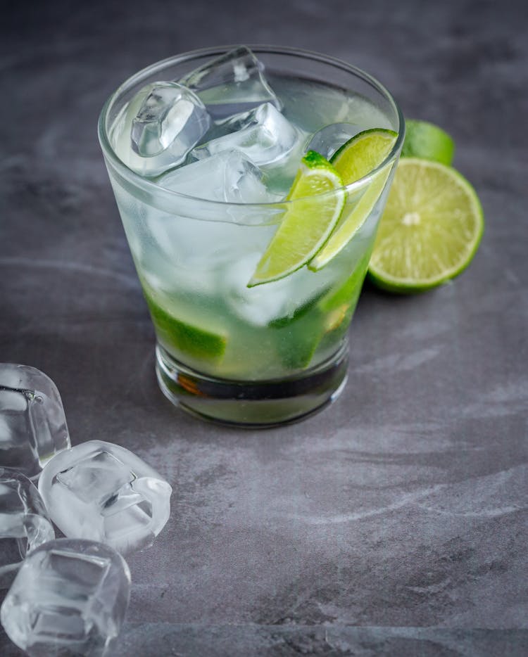 Cold Drink With Ice Cubes And Limes