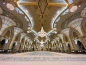 Stunning interior view of Qasr Al Watan, showcasing its grand chandeliers and intricate designs.