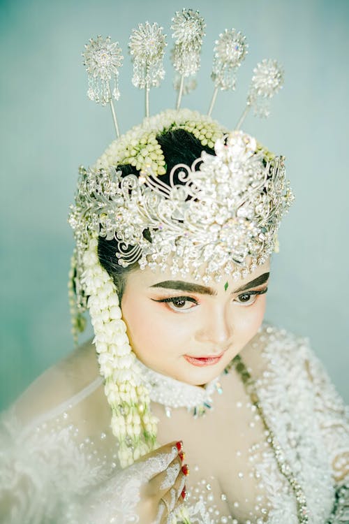 Photo of a Bride Wearing Traditional Clothing and Jewelry 