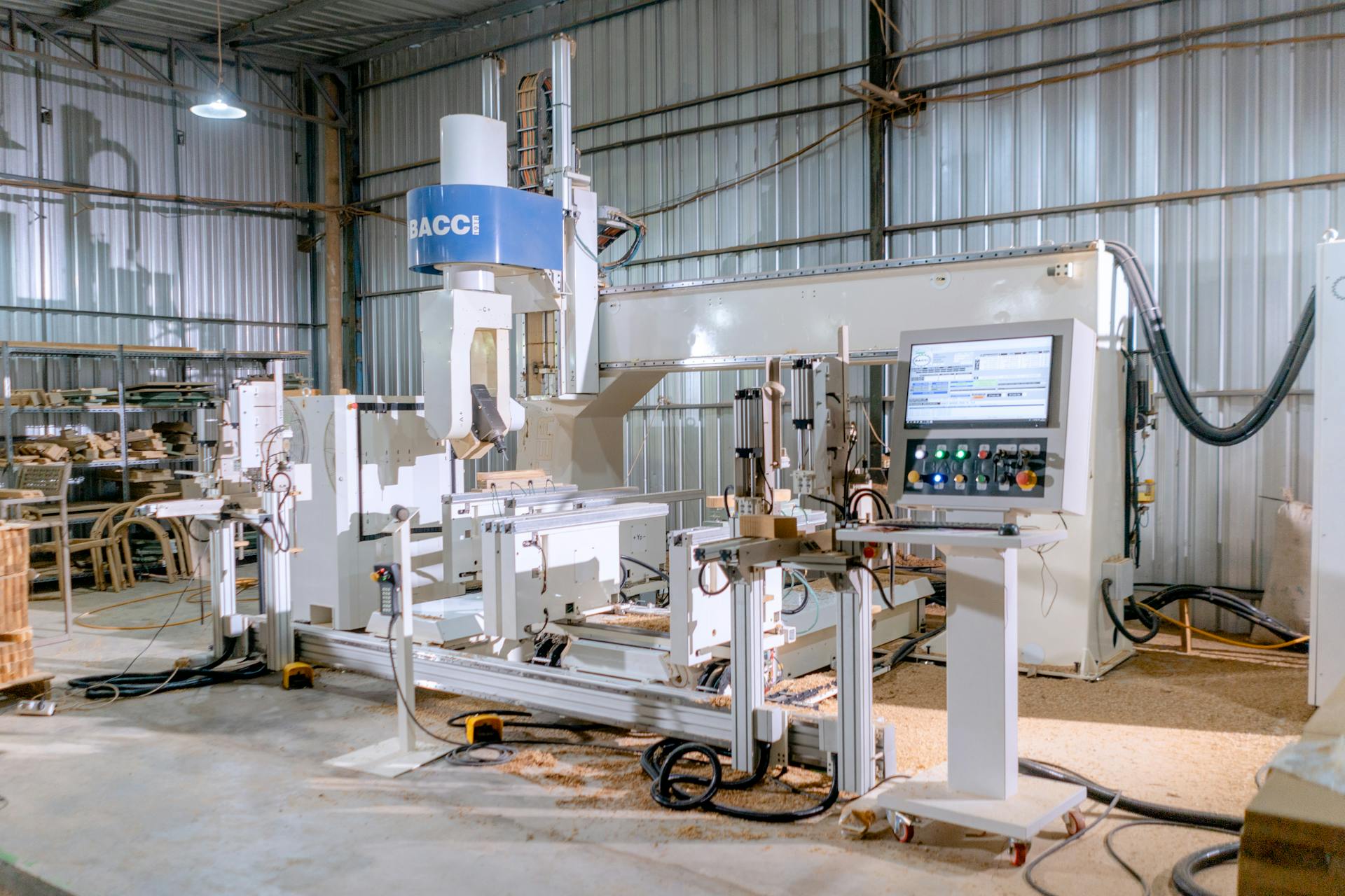 High-tech woodworking machine in an industrial workshop for precision carpentry.