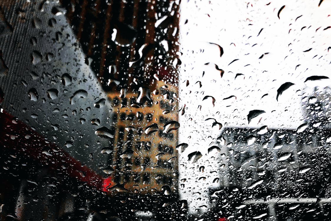 Free Close-up Photography of Water Droplets on Clear Glass Stock Photo