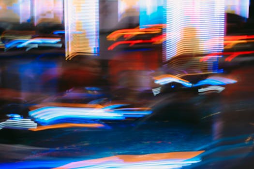 Vibrant abstract image featuring blurred motion and colorful neon lights, creating a dynamic visual effect.