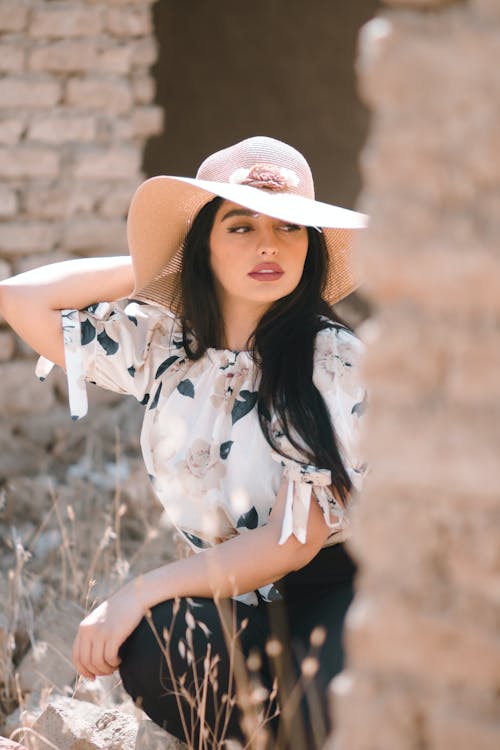 Young Brunette in a Hat and Elegant Clothing 