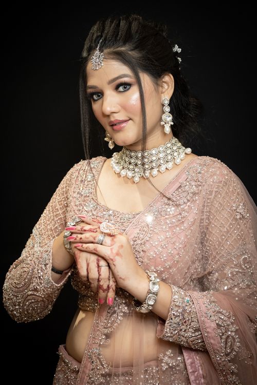 Free Elegant portrait of a woman in traditional attire adorned with intricate jewelry. Stock Photo