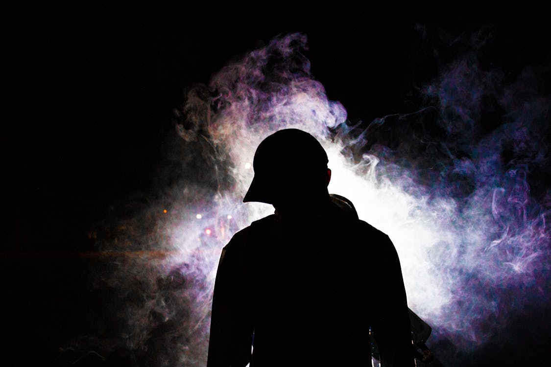 Free Silhouette Photography of Smoke Behind Person Stock Photo
