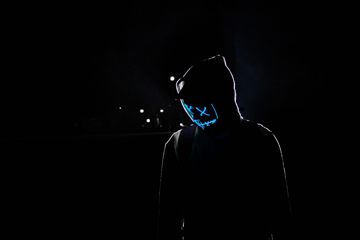 Silhouetted figure in hoodie against dark background — editorial visual for shonen anime analysis