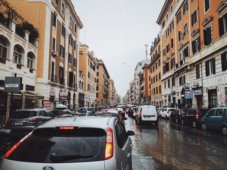 Cars Stuck On Traffic Between Buildings