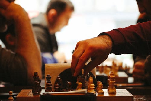 Close-up of People Playing Chess