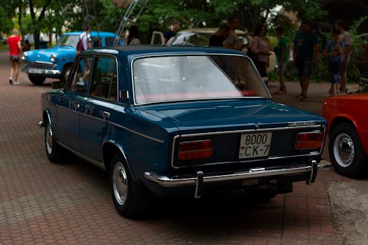 Rear view of a vintage blue car parked outdoors in Minsk, Belarus.