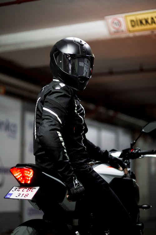 Photo of a Person Wearing a Black Helmet