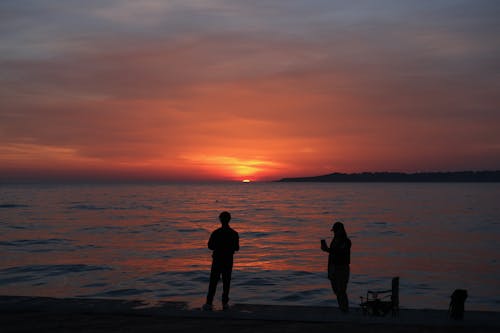 akşam karanlığı, arkadan aydınlatılmış, deniz içeren Ücretsiz stok fotoğraf