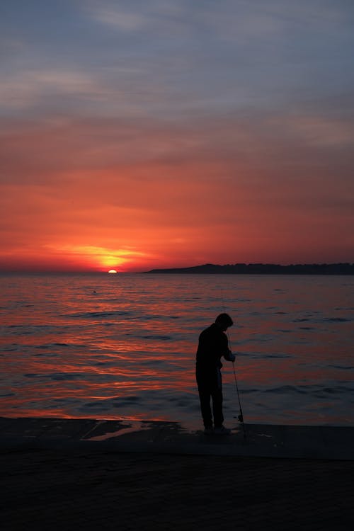 Ücretsiz adam, Balık tutmak, deniz içeren Ücretsiz stok fotoğraf Stok Fotoğraflar