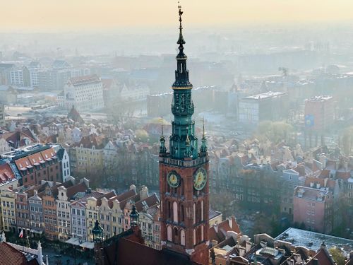 Free Captivating aerial view of historic Gdańsk Town Hall with a vibrant cityscape in Poland's Old Town. Stock Photo