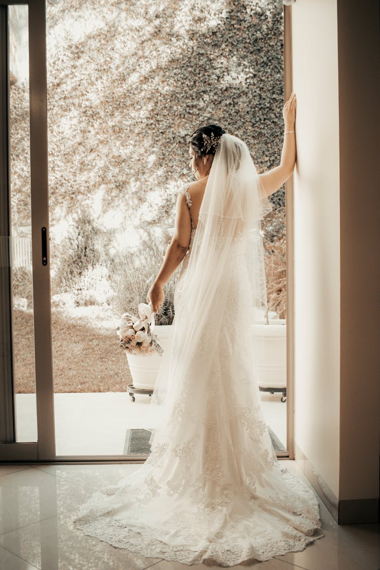 Back View Of The Bride With White Veil 