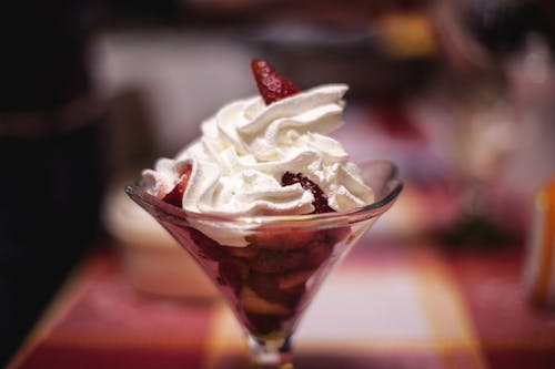 Selective Focus Photography of Ice Cream Top With Strawberries