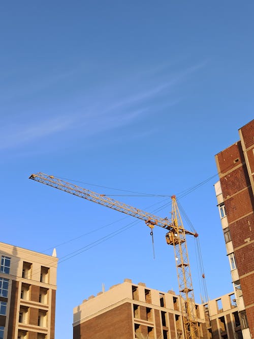 Low-Angle Shot of Concrete Buildings under the Blue Sky