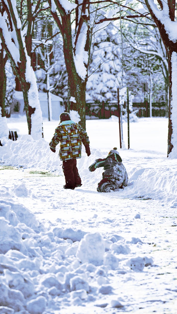 Photograph Of Kids Playing On The Snow