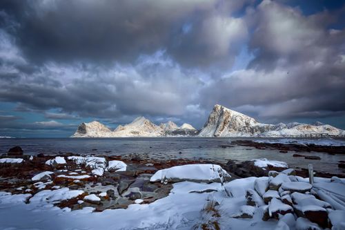 Free Majestic snow-covered peaks and tranquil seas in the Lofoten Islands, Norway. Stock Photo