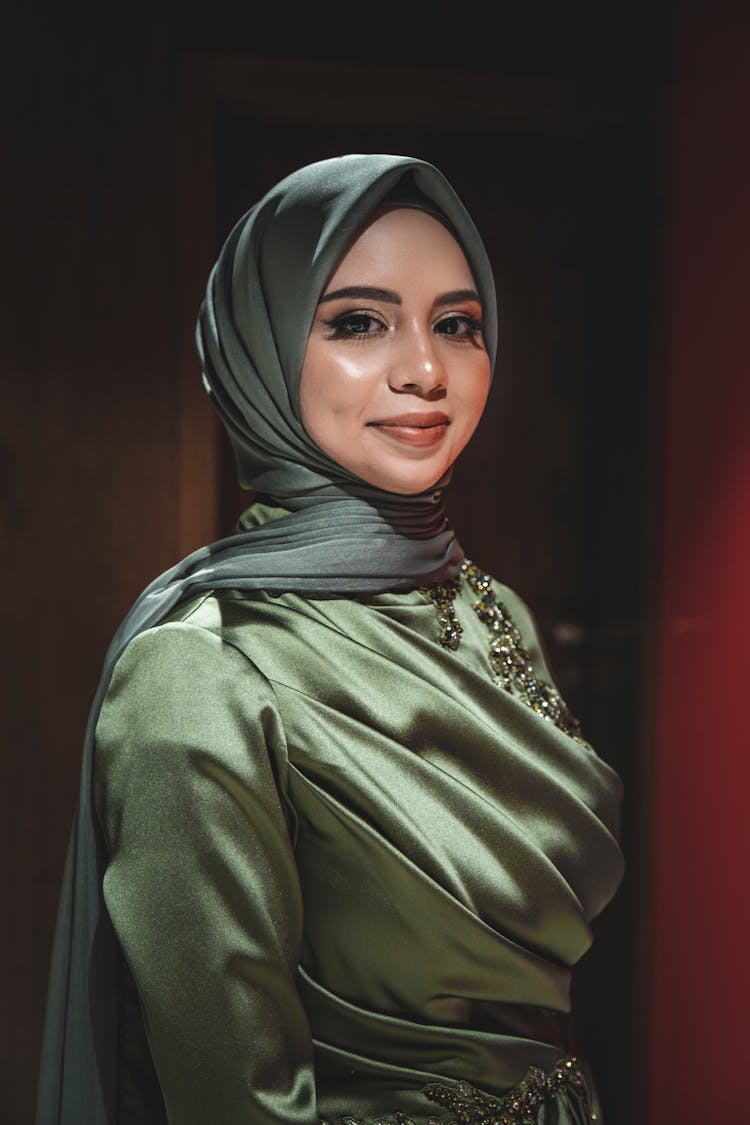 Portrait Of Smiling Woman Wearing Green Satin Hijab