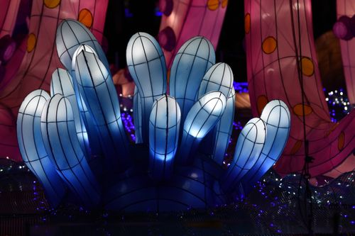 Free Colorful, illuminated art installation with abstract shapes glowing at night. Stock Photo