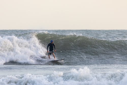 Surfer Riding the Waves