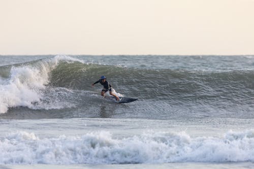 A Man Surfing on the Sea